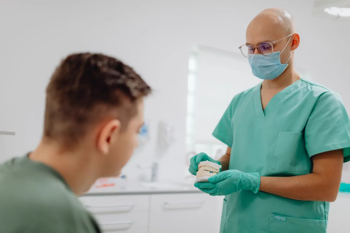 Dentist talking with a patient about their dental care